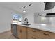 Bright kitchen features stainless steel appliances, quartz countertops, modern cabinets, and light wood flooring at 1108 Putnam Ave, North Las Vegas, NV 89030