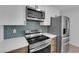 Close-up view of kitchen appliances, custom backsplash, and modern cabinetry at 1108 Putnam Ave, North Las Vegas, NV 89030
