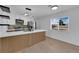 Bright kitchen features stainless steel appliances, quartz countertops, modern cabinets, and light wood flooring at 1108 Putnam Ave, North Las Vegas, NV 89030