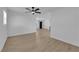 Bright living room featuring new floors, a ceiling fan, and ample natural light through the windows at 1108 Putnam Ave, North Las Vegas, NV 89030