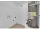 Utility room with new water heater and connections for washer and dryer at 1108 Putnam Ave, North Las Vegas, NV 89030