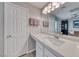 Bright bathroom features a spacious vanity with modern fixtures and ample storage at 11334 Patores St, Las Vegas, NV 89141
