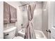 Cozy bathroom features a shower-tub combo with neutral accents and a convenient toilet at 11334 Patores St, Las Vegas, NV 89141