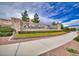 Stone sign marking the entrance to Southern Highlands, enhanced with vibrant floral landscaping at 11334 Patores St, Las Vegas, NV 89141