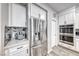 Kitchen features stainless steel appliances, built-in ovens, and stylish tile backsplash at 11334 Patores St, Las Vegas, NV 89141
