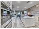 Contemporary kitchen with stainless steel appliances, center island, and abundant cabinetry at 11334 Patores St, Las Vegas, NV 89141