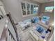 Aerial view of the living room and kitchen areas featuring an open-concept design at 11334 Patores St, Las Vegas, NV 89141
