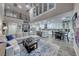 Spacious living room with soaring ceilings, and an open floor plan to the kitchen at 11334 Patores St, Las Vegas, NV 89141