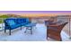 Relaxing patio furniture with stunning views of the desert landscape at dusk at 11334 Patores St, Las Vegas, NV 89141