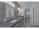 A spacious bathroom featuring a double vanity and modern lighting at 12 Golden View St, Henderson, NV 89012