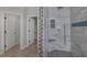 This luxurious bathroom includes a glass enclosed shower, tiled walls and floors and a built-in niche at 12 Golden View St, Henderson, NV 89012
