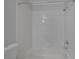 Bathroom featuring a shower-tub combo, and white tiled walls at 12 Golden View St, Henderson, NV 89012