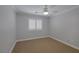 This bedroom features a neutral-colored walls, plush carpet and a window with shutters at 12 Golden View St, Henderson, NV 89012