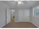 This is a bedroom with a ceiling fan and an open door leading to the bathroom at 12 Golden View St, Henderson, NV 89012