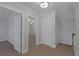 Carpeted hallway between bedrooms with neutral colored walls at 12 Golden View St, Henderson, NV 89012