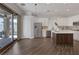 Open-concept kitchen and dining area with modern appliances and access to the outdoors at 12 Golden View St, Henderson, NV 89012