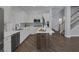 Kitchen featuring stainless appliances, white cabinets, and a center island at 12 Golden View St, Henderson, NV 89012