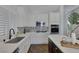 Well-lit kitchen features modern stainless steel appliances, island, and stylish backsplash at 12 Golden View St, Henderson, NV 89012