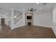 Spacious living room featuring a stone fireplace and hardwood flooring at 12 Golden View St, Henderson, NV 89012