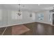 Elegant living room boasting hardwood floors, decorative trim, and plantation shutters at 12 Golden View St, Henderson, NV 89012