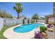 A sparkling blue backyard pool featuring desert landscaping, patio area, and tall shade trees at 12 Golden View St, Henderson, NV 89012