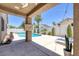 Inviting backyard pool with covered patio and desert landscaping, perfect for outdoor entertaining at 12 Golden View St, Henderson, NV 89012