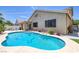 A stunning pool with steps for easy access and surrounded by lush greenery at 12 Golden View St, Henderson, NV 89012
