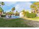 Spacious backyard with pool, lush landscaping, and mature trees at 1393 Calmview Pl, Las Vegas, NV 89110