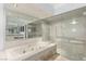 Beautiful bathroom with a separate tub and glass shower at 1393 Calmview Pl, Las Vegas, NV 89110