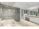 Modern bathroom featuring double sinks, a separate bathtub, and a glass-enclosed shower at 1393 Calmview Pl, Las Vegas, NV 89110