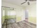 Bright bedroom with wood-look floors, mirrored closet and fan offering a relaxing space at 1393 Calmview Pl, Las Vegas, NV 89110