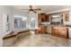 Dining area with bar, custom cabinetry, bay window with seating, and tile floors at 1393 Calmview Pl, Las Vegas, NV 89110