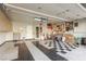 Functional garage with black and white floor, cabinets and work space for storage and projects at 1393 Calmview Pl, Las Vegas, NV 89110