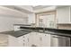 Kitchen with white cabinetry, granite countertops, and stainless steel appliances at 1393 Calmview Pl, Las Vegas, NV 89110