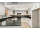 Kitchen with white cabinetry, granite countertops, and stainless steel appliances at 1393 Calmview Pl, Las Vegas, NV 89110