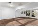 Main bedroom with carpeted floors, natural light, and an open design concept at 1393 Calmview Pl, Las Vegas, NV 89110