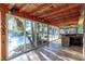 Enclosed patio with tile flooring, stone bar, and access to the pool, ideal for entertaining at 1393 Calmview Pl, Las Vegas, NV 89110
