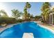 Beautiful pool and jacuzzi with well manicured landscaping in backyard at 1393 Calmview Pl, Las Vegas, NV 89110