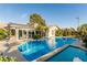 Backyard pool with solar panels on roof and clear blue water, perfect for relaxation and enjoyment at 1393 Calmview Pl, Las Vegas, NV 89110