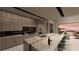 Gourmet kitchen with premium appliances and stone countertops seamlessly connects to the living area at 1508 Pleasant Bay Ct, Henderson, NV 89011