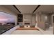 Serene main bedroom with fireplace and lake views offering a private retreat within the home at 1508 Pleasant Bay Ct, Henderson, NV 89011