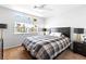 Bedroom with a dark bed set and a window with views of palm trees at 179 Adomeit Dr, Henderson, NV 89074