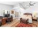 Bedroom features a ceiling fan, a work area, and a bench to enhance a comfortable living space at 179 Adomeit Dr, Henderson, NV 89074