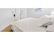Bright bedroom featuring a plush bed and a glimpse into the ensuite bathroom at 179 Adomeit Dr, Henderson, NV 89074