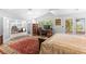 Spacious bedroom with a work area, balcony access, and comfortable bench seating at 179 Adomeit Dr, Henderson, NV 89074