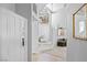 Bright entryway with high ceilings, white accents and tile flooring, and a double-door entrance at 179 Adomeit Dr, Henderson, NV 89074