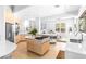 Open-concept kitchen with an island gas cooktop and stainless-steel appliances at 179 Adomeit Dr, Henderson, NV 89074