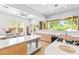 Bright eat-in kitchen boasts modern appliances, sleek countertops, and breakfast nook at 179 Adomeit Dr, Henderson, NV 89074