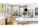 Beautiful eat-in kitchen with stainless steel appliances and modern finishes at 179 Adomeit Dr, Henderson, NV 89074