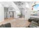 Spacious living area with a staircase, tile flooring, and comfortable sofa at 179 Adomeit Dr, Henderson, NV 89074